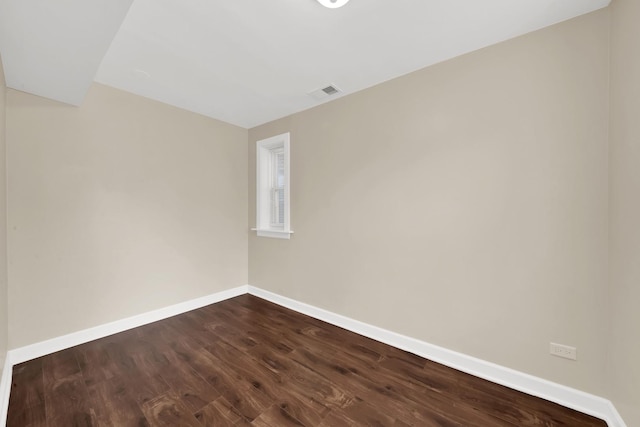 2720 S Christiana Ave, Chicago, IL 60623 - empty room with baseboards, dark wood-style floors, and visible vents