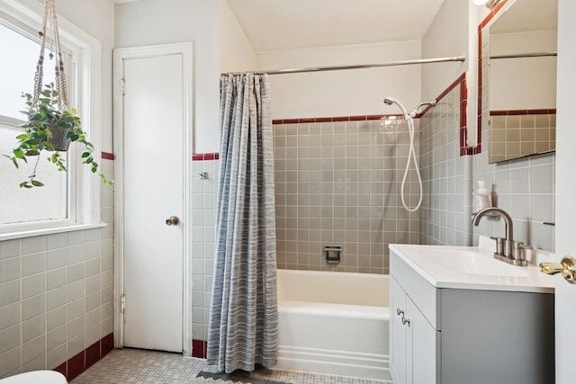 2815 W Jarvis Ave, Chicago, IL 60645 - bathroom with tile walls, shower / tub combo with curtain, and vanity