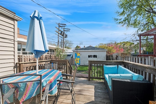 2815 W Jarvis Ave, Chicago, IL 60645 - wooden deck with an outbuilding, outdoor dining space, and fence