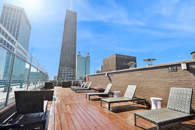 260 E Chestnut St Unit 1706, Chicago, IL 60611 - wooden deck featuring a skyline view