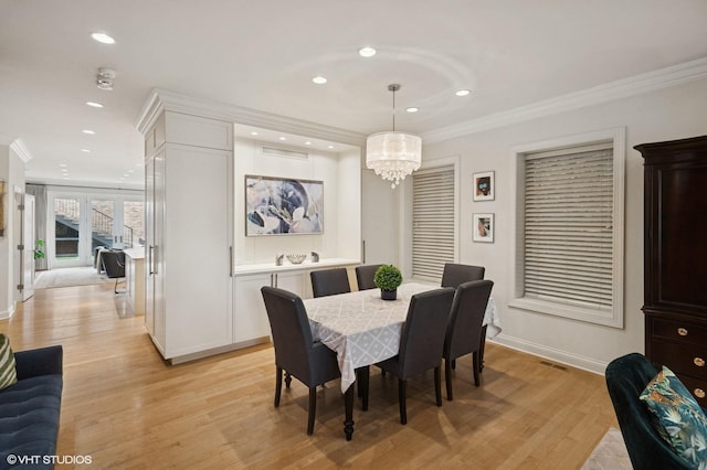 1442 W Cuyler Ave, Chicago, IL 60613 - dining space with ornamental molding, light wood finished floors, an inviting chandelier, and recessed lighting
