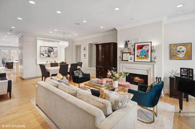 1442 W Cuyler Ave, Chicago, IL 60613 - living area with recessed lighting, crown molding, a lit fireplace, baseboards, and light wood-style floors