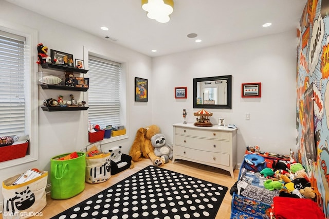 1442 W Cuyler Ave, Chicago, IL 60613 - recreation room with recessed lighting, visible vents, and wood finished floors