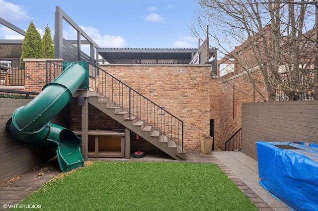 1442 W Cuyler Ave, Chicago, IL 60613 - exterior space featuring a lawn, stairway, and fence