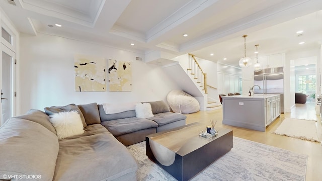 living room with light wood-type flooring, beam ceiling, stairway, recessed lighting, and ornamental molding