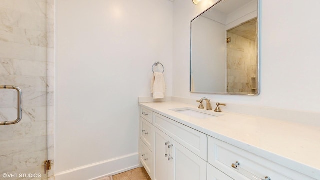 bathroom with a stall shower and vanity