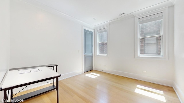 unfurnished bedroom with light wood-style floors and baseboards