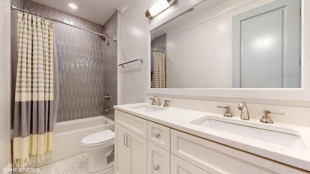 full bathroom featuring shower / bathtub combination with curtain, toilet, double vanity, and tile patterned flooring