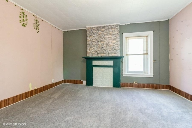 1027 Paul St, Ottawa, IL 61350 - unfurnished living room with ornamental molding, a fireplace, and carpet flooring