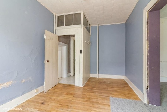 1027 Paul St, Ottawa, IL 61350 - spare room featuring wood finished floors, crown molding, and baseboards