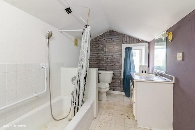 1027 Paul St, Ottawa, IL 61350 - bathroom featuring toilet, vaulted ceiling, shower / tub combo, and vanity