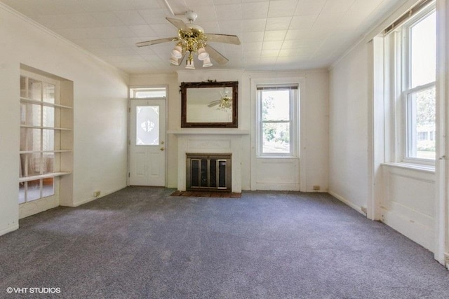 1027 Paul St, Ottawa, IL 61350 - unfurnished living room with ornamental molding, a ceiling fan, a glass covered fireplace, and carpet