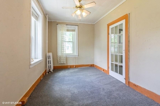 1027 Paul St, Ottawa, IL 61350 - unfurnished room featuring radiator, ornamental molding, carpet, ceiling fan, and baseboards