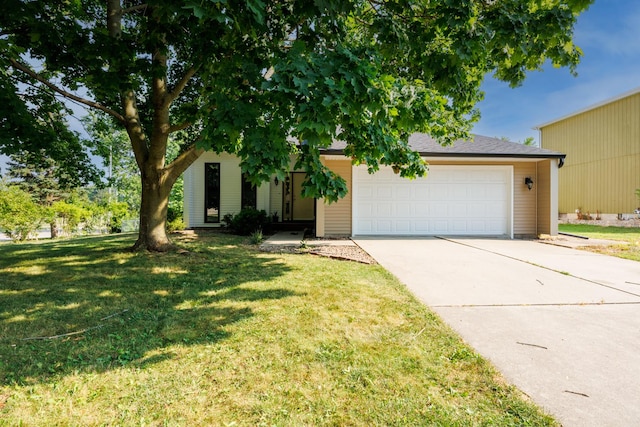 107 Regal Dr, Normal, IL 61761 - obstructed view of property featuring driveway, an attached garage, and a front yard