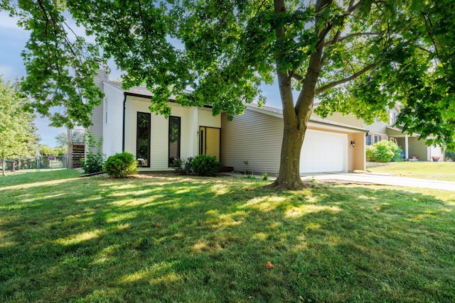 107 Regal Dr, Normal, IL 61761 - view of front of house featuring a garage, driveway, and a chimney