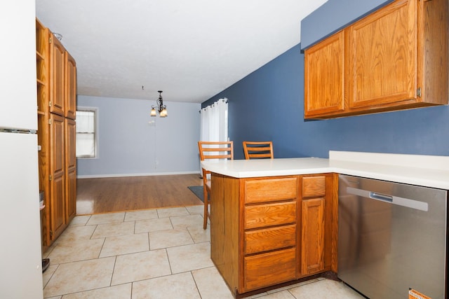 107 Regal Dr, Normal, IL 61761 - kitchen with stainless steel dishwasher, a peninsula, and brown cabinetry