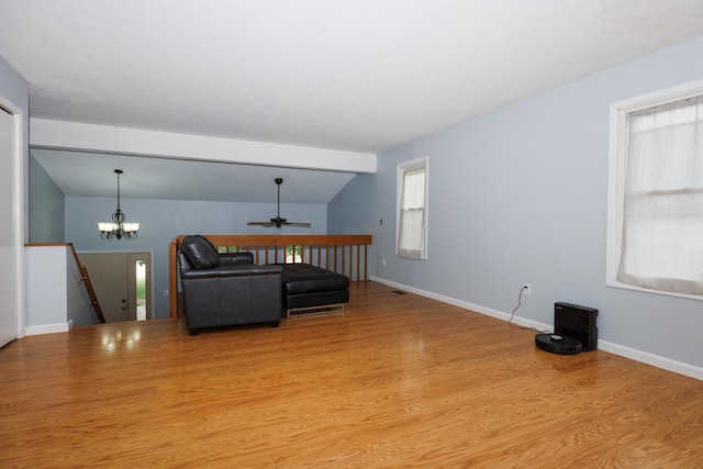 107 Regal Dr, Normal, IL 61761 - living room featuring a ceiling fan, light wood finished floors, lofted ceiling, and a chandelier