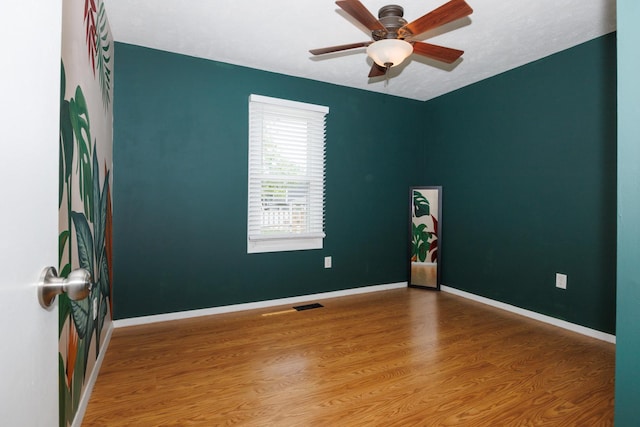 107 Regal Dr, Normal, IL 61761 - unfurnished room featuring wood finished floors and ceiling fan