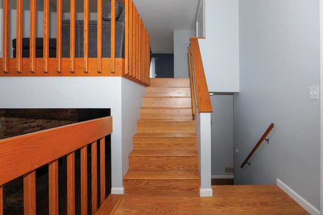 107 Regal Dr, Normal, IL 61761 - staircase with wood finished floors and baseboards