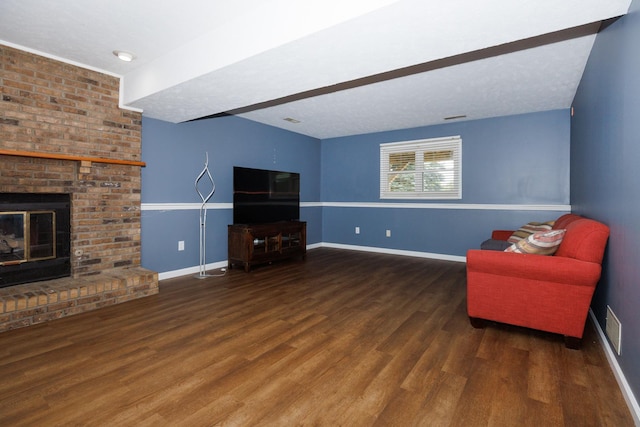 107 Regal Dr, Normal, IL 61761 - living room featuring wood finished floors and a brick fireplace