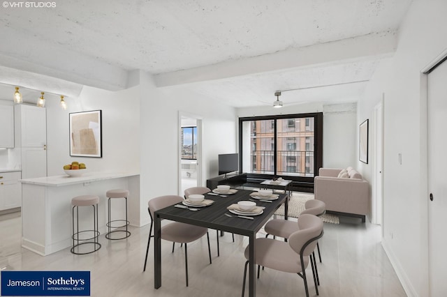 345 N Canal St Unit 1003, Chicago, IL 60606 - dining space featuring beam ceiling and baseboards