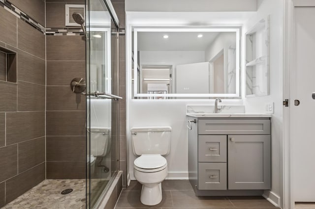 345 N Canal St Unit 1003, Chicago, IL 60606 - full bath featuring a stall shower, vanity, toilet, tile patterned floors, and recessed lighting