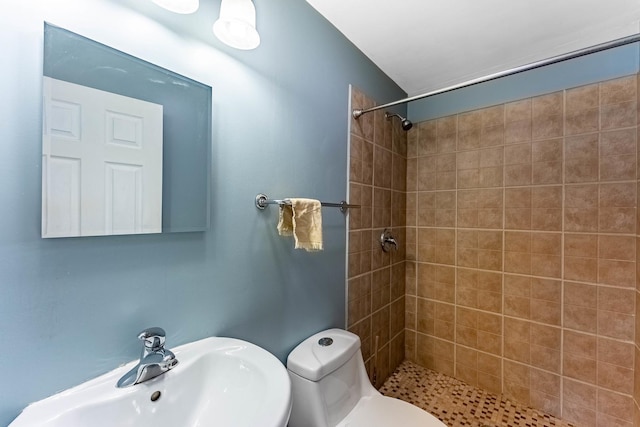 204 N Rohlwing Rd, Palatine, IL 60074 - bathroom with a sink, tiled shower, and toilet