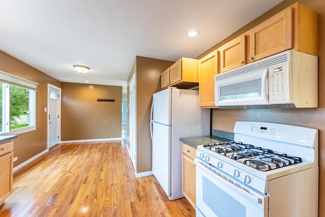 204 N Rohlwing Rd, Palatine, IL 60074 - kitchen featuring white appliances, light brown cabinets, light wood-type flooring, recessed lighting, and dark countertops