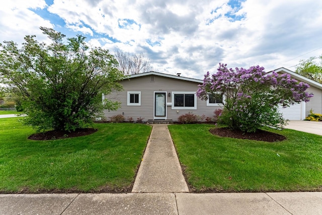 204 N Rohlwing Rd, Palatine, IL 60074 - ranch-style house with a front yard, a garage, and driveway