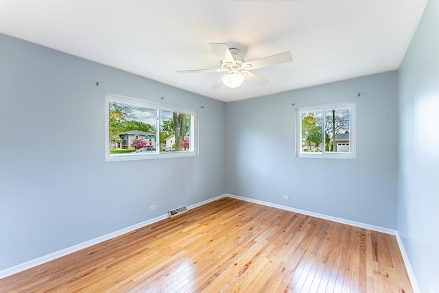 204 N Rohlwing Rd, Palatine, IL 60074 - spare room with hardwood / wood-style floors, a ceiling fan, and baseboards