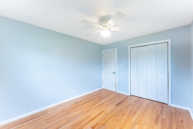 204 N Rohlwing Rd, Palatine, IL 60074 - unfurnished bedroom with light wood-style flooring, baseboards, a closet, and ceiling fan