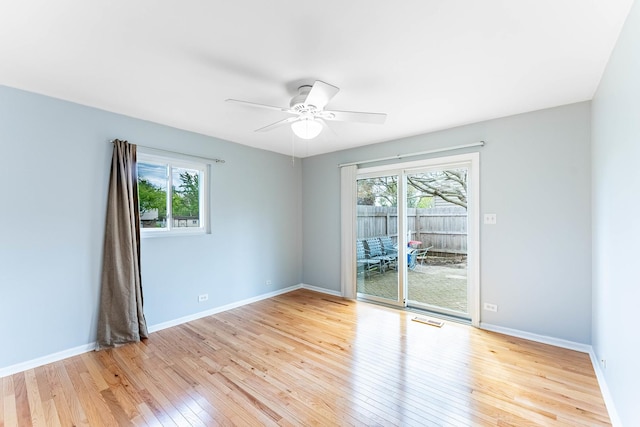 204 N Rohlwing Rd, Palatine, IL 60074 - empty room with plenty of natural light, light wood-style floors, a ceiling fan, and baseboards