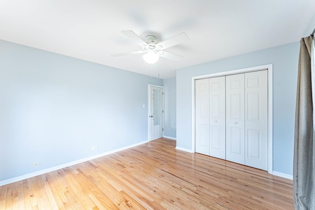 204 N Rohlwing Rd, Palatine, IL 60074 - unfurnished bedroom featuring baseboards, light wood-type flooring, a closet, and a ceiling fan