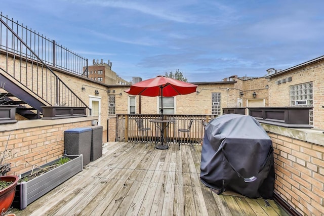 wooden deck featuring grilling area