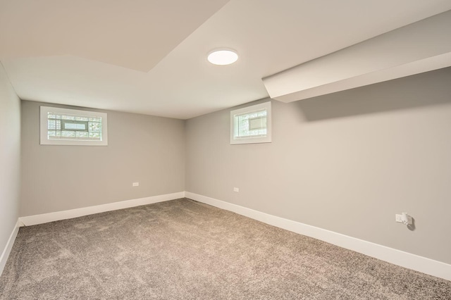 basement with carpet flooring and baseboards