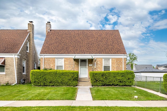 4233 Grove Ave, Brookfield, IL 60513 - view of front of property with a chimney, brick siding, and roof with shingles