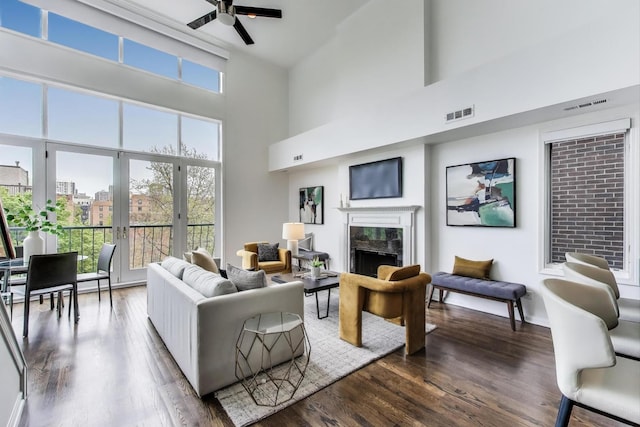 1426 N Cleveland Ave Unit 3, Chicago, IL 60610 - living room with a towering ceiling, a premium fireplace, a ceiling fan, and dark wood-type flooring