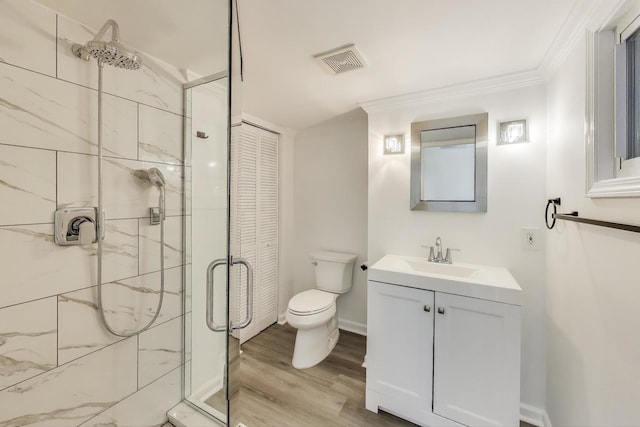 1426 N Cleveland Ave Unit 3, Chicago, IL 60610 - bathroom with a shower stall, toilet, ornamental molding, vanity, and wood finished floors