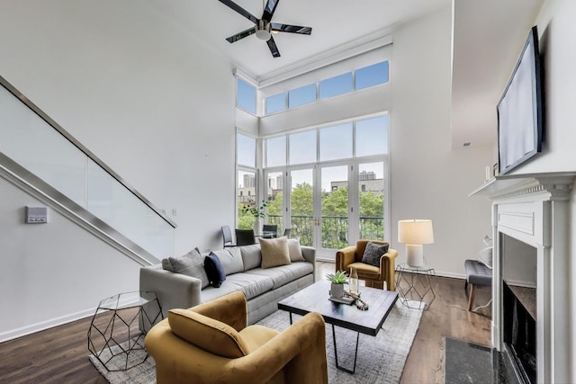 1426 N Cleveland Ave Unit 3, Chicago, IL 60610 - living room featuring a premium fireplace, plenty of natural light, a high ceiling, and wood finished floors