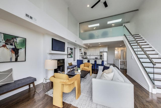 1426 N Cleveland Ave Unit 3, Chicago, IL 60610 - living area featuring stairway, wood finished floors, a high ceiling, a premium fireplace, and baseboards