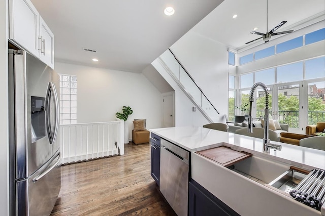 1426 N Cleveland Ave Unit 3, Chicago, IL 60610 - kitchen with stainless steel appliances, a sink, recessed lighting, wood finished floors, and open floor plan