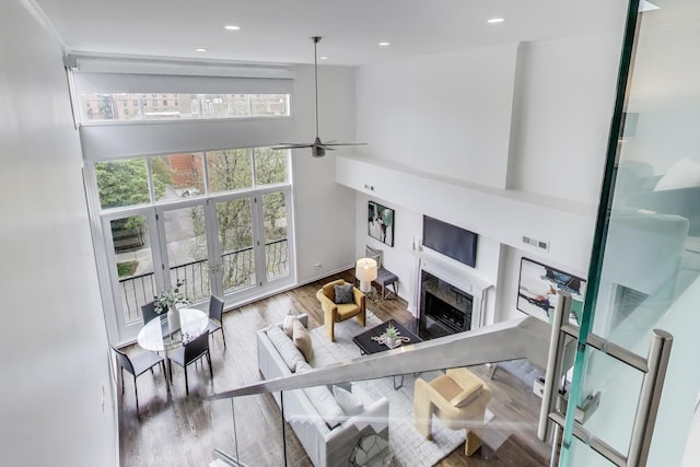1426 N Cleveland Ave Unit 3, Chicago, IL 60610 - living area featuring a high end fireplace, wood finished floors, ceiling fan, recessed lighting, and baseboards