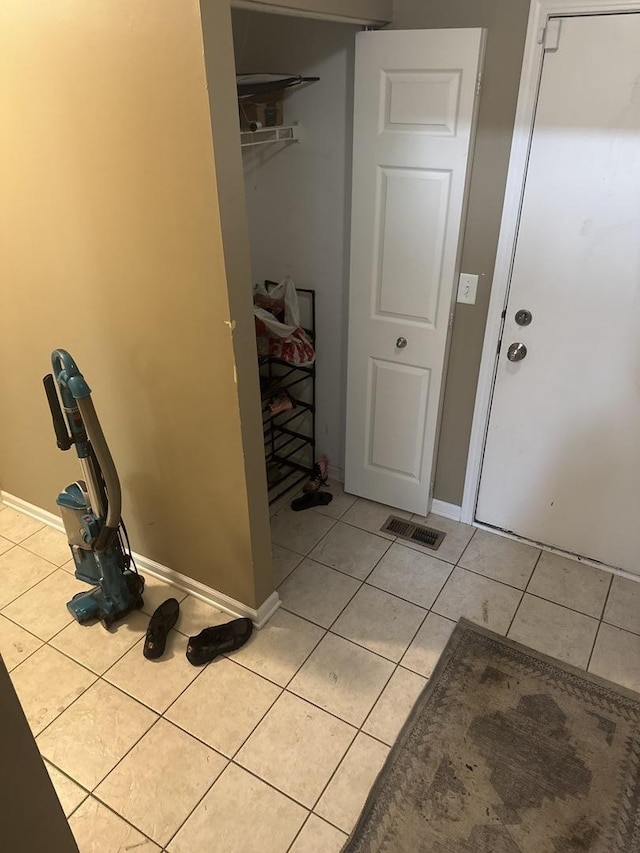 5588 Cambridge Way, Hanover Park, IL 60133 - interior space with light tile patterned floors, visible vents, and baseboards