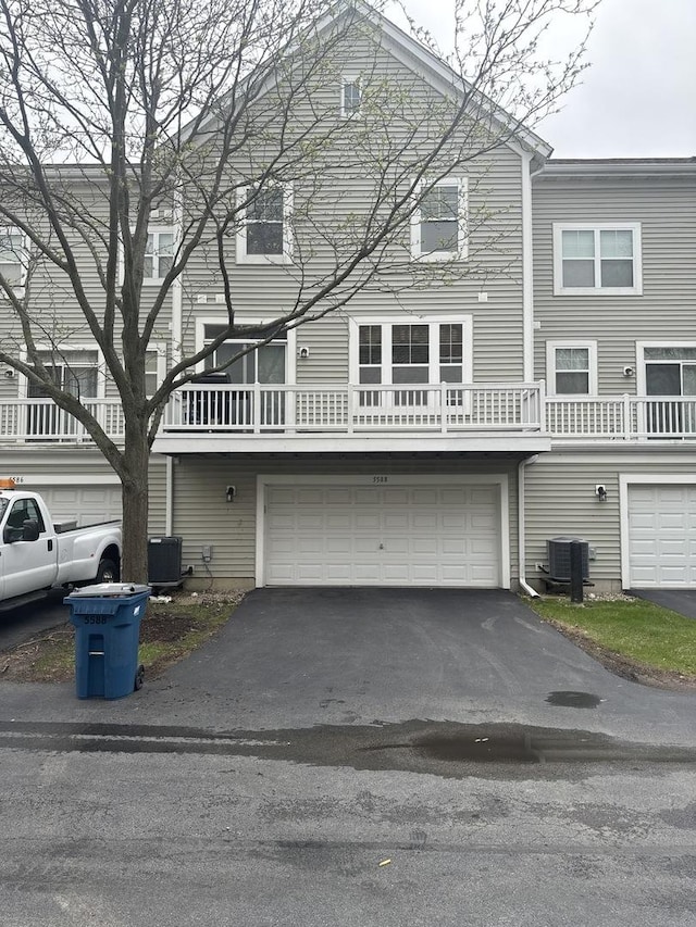 5588 Cambridge Way, Hanover Park, IL 60133 - townhome / multi-family property featuring an attached garage and driveway