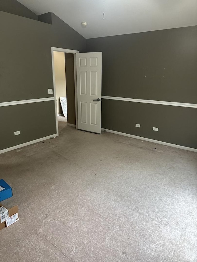 5588 Cambridge Way, Hanover Park, IL 60133 - unfurnished bedroom with baseboards, carpet, and vaulted ceiling