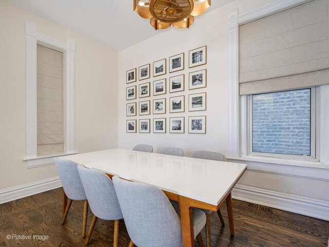 2426 W Mclean Ave, Chicago, IL 60647 - dining area with dark wood-type flooring and baseboards