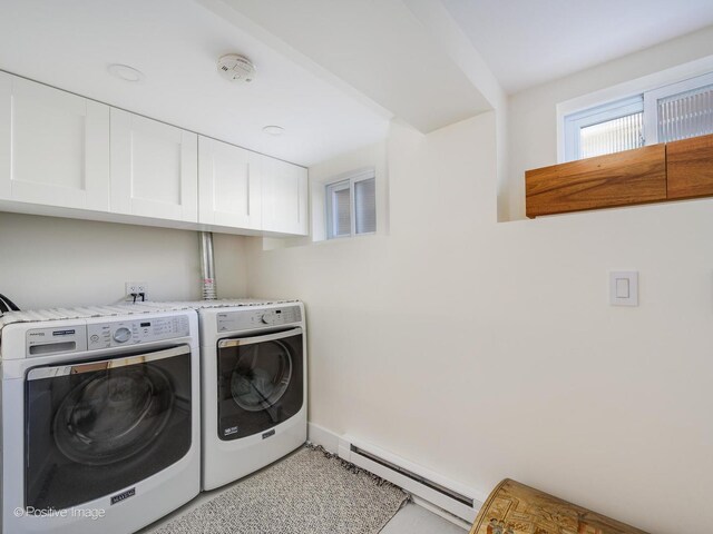 2426 W Mclean Ave, Chicago, IL 60647 - laundry area featuring a baseboard radiator, washing machine and clothes dryer, cabinet space, and baseboards