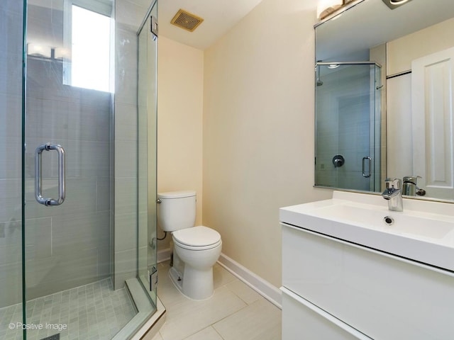 2426 W Mclean Ave, Chicago, IL 60647 - full bath featuring toilet, vanity, tile patterned floors, a shower stall, and baseboards