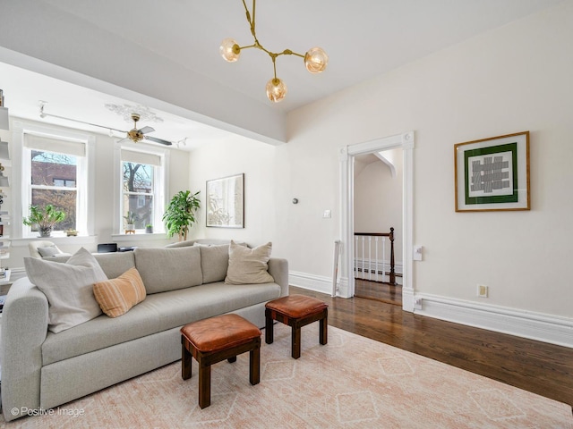 2426 W Mclean Ave, Chicago, IL 60647 - living room with wood finished floors, baseboards, a chandelier, and a baseboard heating unit