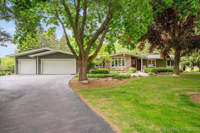 6N198 Old Homestead Rd, Saint Charles, IL 60175 - view of front of house with a front lawn, driveway, and stone siding